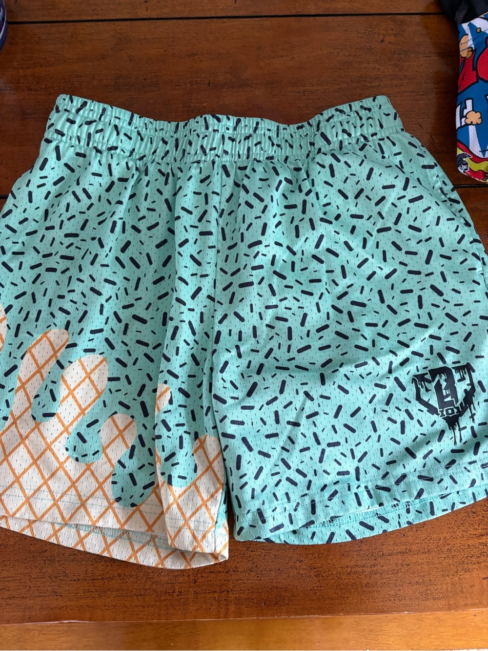 Baseball Lifestyle Aqua Patterned Shorts with Orange Accent